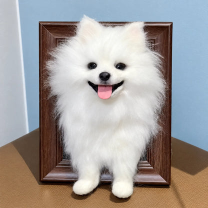 Framed needle-felted white dog portrait against a light blue background