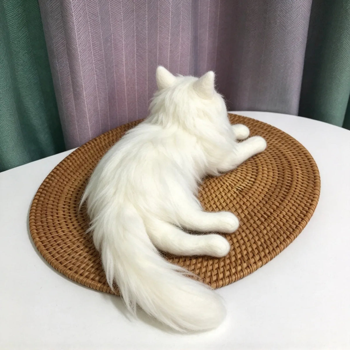 Custom needle-felted cat sculpture showing the pet’s body and markings